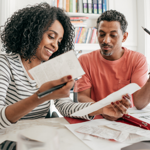 Two people looking at documents