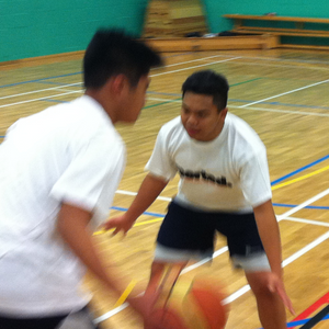 two boys playing basketball