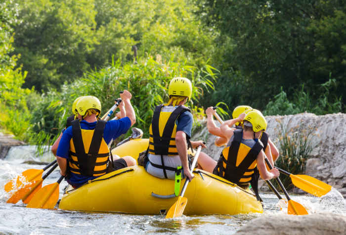 people on a white water raft
