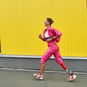woman with prosthetic leg running