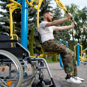 man exercising next to wheelchair