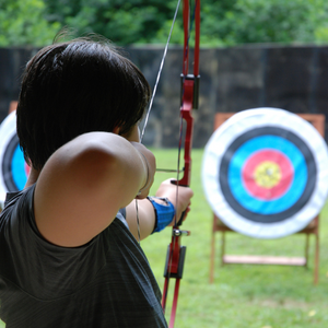 boy shooting at archery target