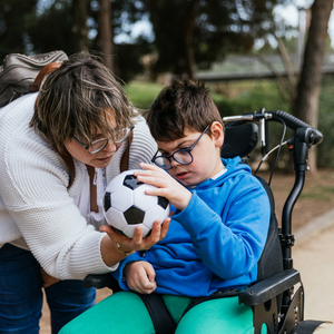 boy in wheelchair with woman